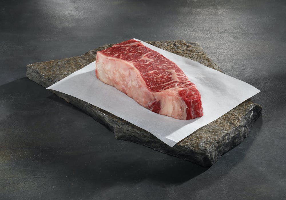 american-wagyu-black-grade-boneless-new-york-strip-steaks.08bca58ae31d252e9073f0bebff208e1